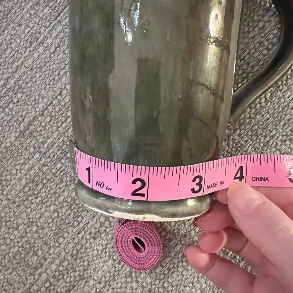 Gorgeous, vintage handmade green ceramic mug with two stars